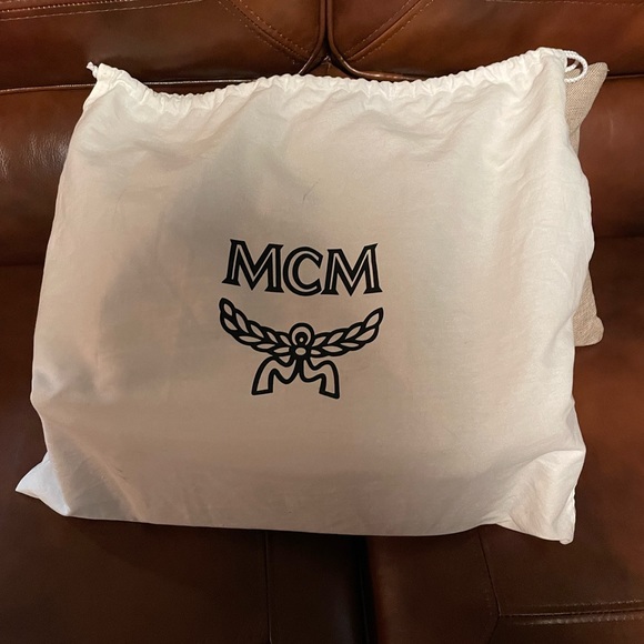 Authentic Cognac Debossed with the MCM emblem and made of supple leather - Picture 11 of 11